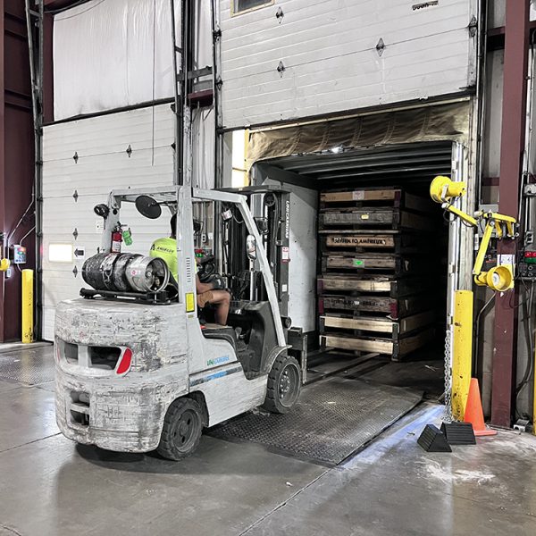 AmeriLux Warehouse - Forklift driver unloading a trailer